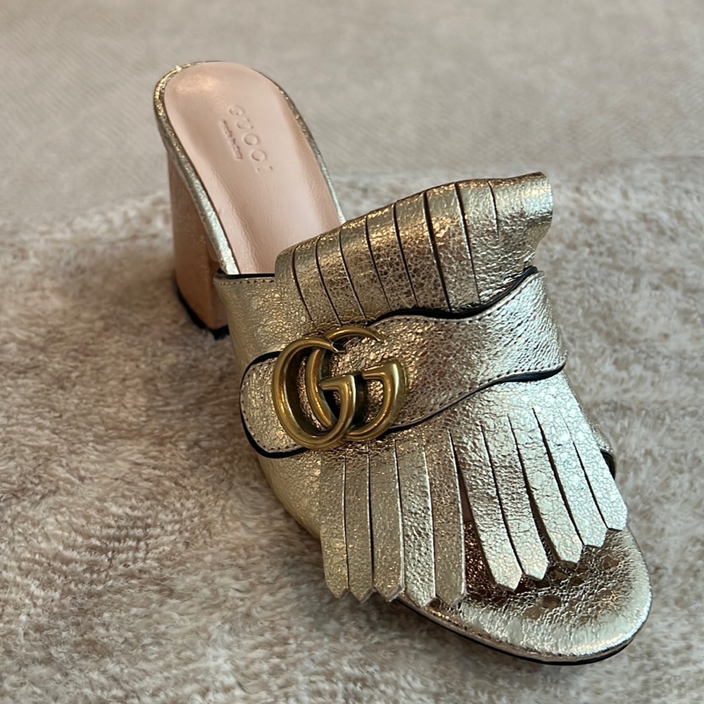 Gucci gold leather tassel slip on